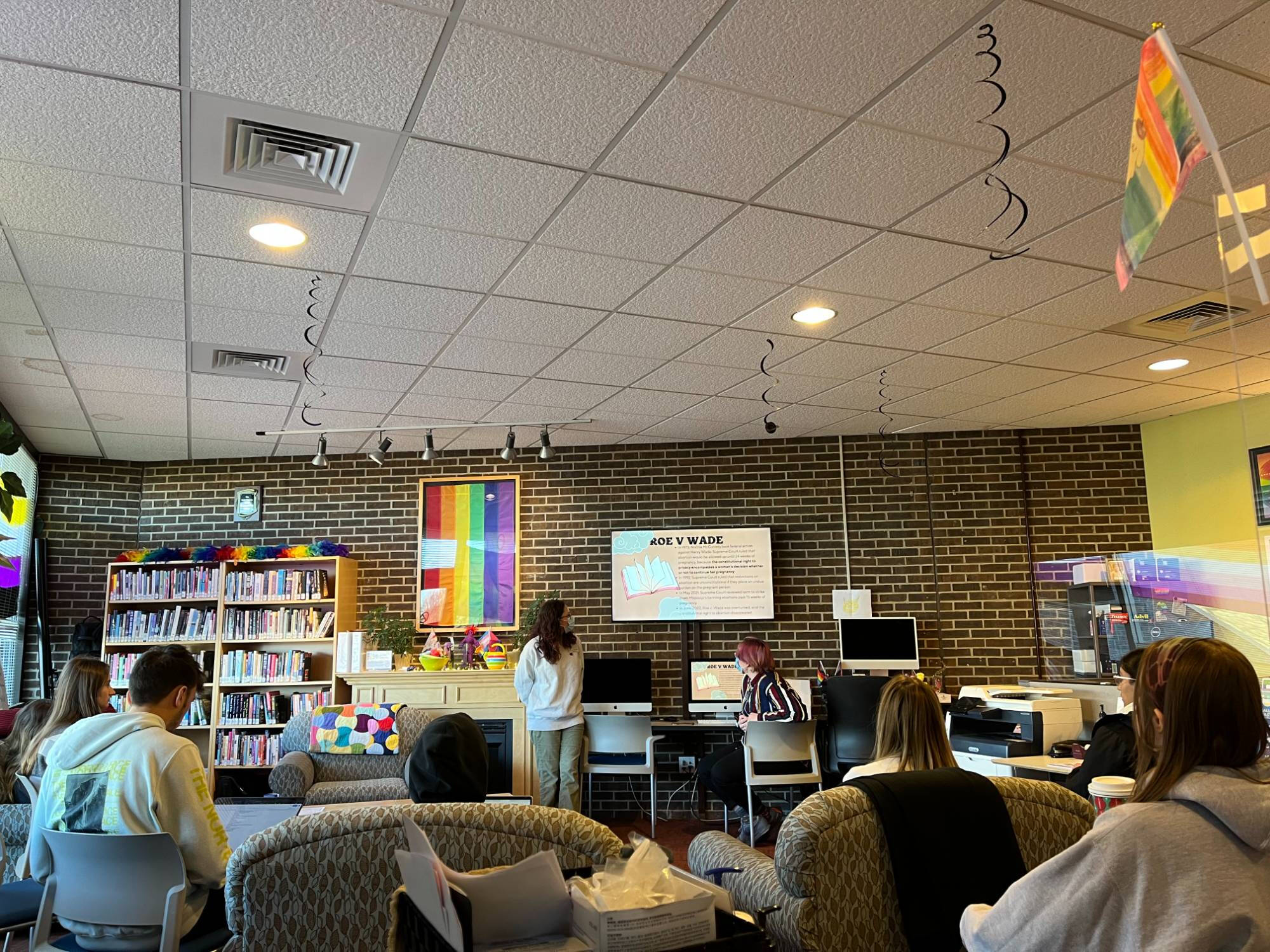 The LGBT Resource Center is full of students listening in to an Open Door Discussion presentation